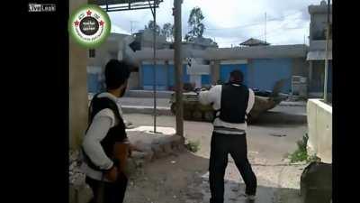 Video showing a Group of Syrian rebels taking a direct hit from a Syrian Army BMP-1, Also shows a FSA fighter almost shooting his foot off with his AK (NSFW) Early 2012/2013, Syria