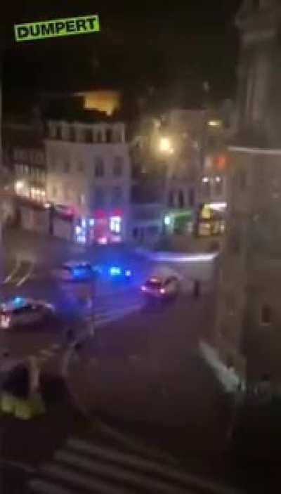 2 officers wounded after trying to stop a van ramming police cars in Amsterdam. Van caught fire.