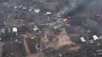 A footage of a lone Ukrainian tank ambushing and destroying a Russian armored column. The lone tank forces the Russian column to retreat, where it is then hit by Ukrainian artillery fire.