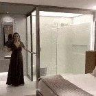 Bathroom glass that turns opaque when the door closes