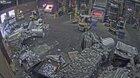 Foundry worker puts wet scrap metal in furnace, November 27, 2019