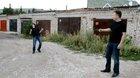 Man tests to see if a helmet is bulletproof with a gun.