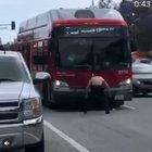 Crazy man attacks bus and cars with rocks. Street justice ensues.