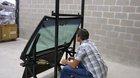 CEO of Texas armored corporation demonstrates the quality of the glass that goes into his armored vehicles by sitting behind a window and taking rounds from an AK-47.