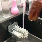 Glass cleaner brush with suction cup