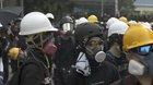 Protestors checking if their helmets work