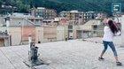 People playing tennis on rooftops in Liguria, Italy
