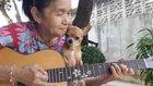 Old lady sings to little dog