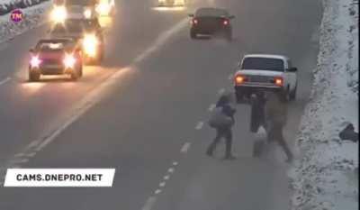 Jay walking across a busy highway