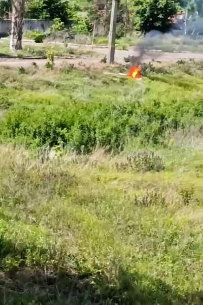 Russian soldiers film a burning Ukrainian drone that was reportedly shot down, after a few seconds it explodes