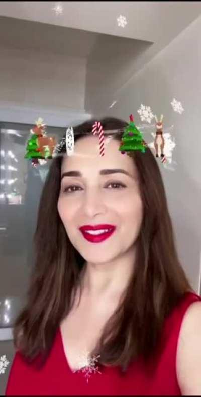 Sexiest milf Madhuri Dixit wishing you merry Christmas. Can't handle those luscious lipstick lips..