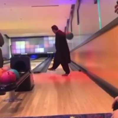 To bowl between his legs