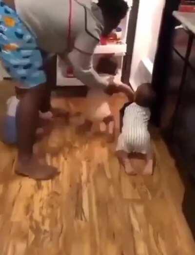 This father of triplets trying to close the fridge door