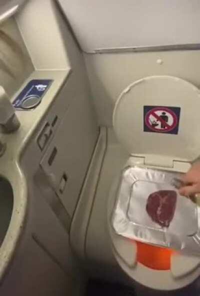 Someone making steak on a airplane