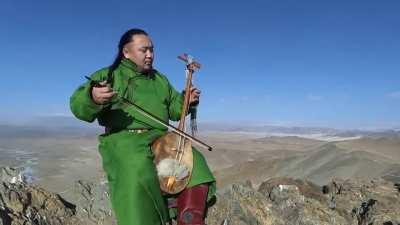 Mongolian Throat Singer performing on the Altai Mountains