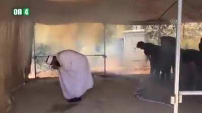 Isreali soldiers harassing Muslims praying, by firing tear gases at them while praying!