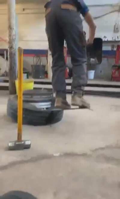 WCGW taking a tire off a rim