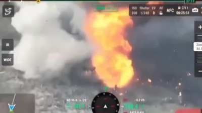 Russian soldiers sent flying through the air, on fire, as their vehicle explodes in a large fireball