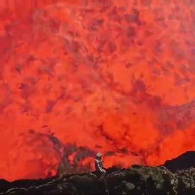 Incredible footage of a man inside the crater of an active volcano.