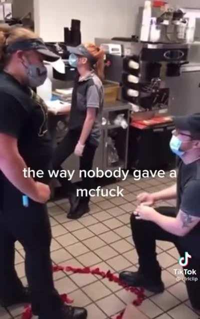 Guy proposes inside McDonald's during a shift and nobody cares