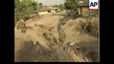 Footage of Nigerian-led West African peacekeepers taking control of Sierra Leone's heavily fortified northern town of Makeni, 1998.