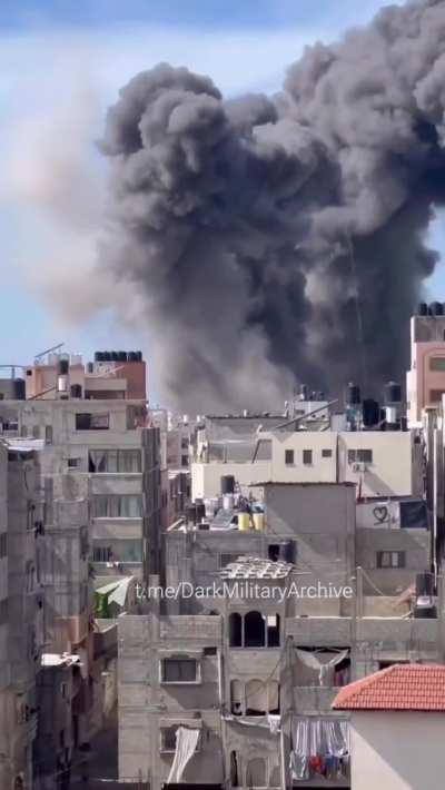 Several bombs being dropped on buildings in Gaza.