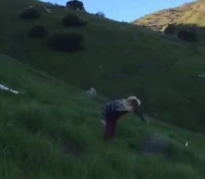 Trying to surf a grassy hill