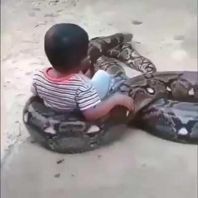 Kid with his pet snake