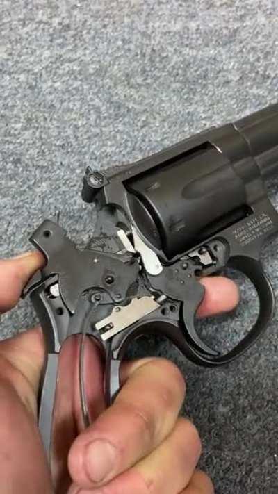 Wheel gun trigger being manipulated without the side plate on. Disclaimer: never do this