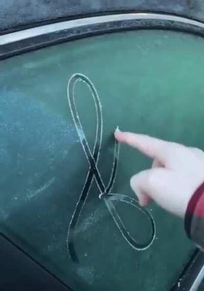 This penmanship on the ice of a car window