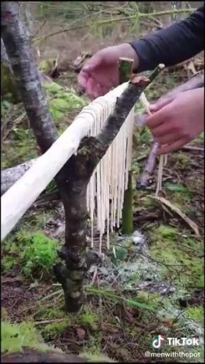 Making delicious homemade pasta in the woods over a campfire