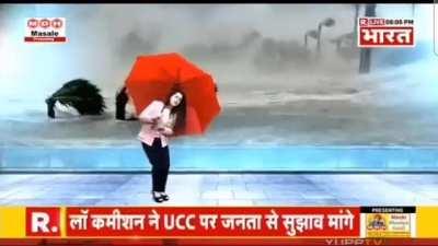 Indian TV news anchor reporting about a cyclone