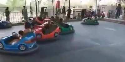 Taliban playing bumper cars after taking control of a theme park in Kabul.