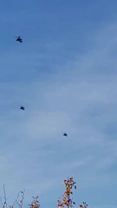 a gaggle of Apache helicopters leaving Ft.WW flying over North Pole Alaska.