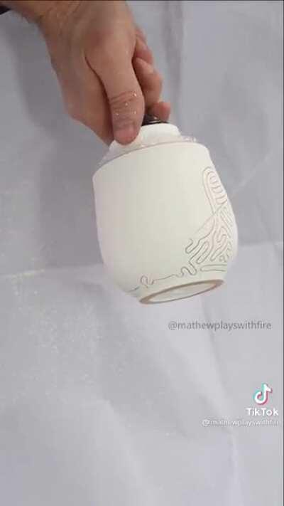 Removing tape from pottery