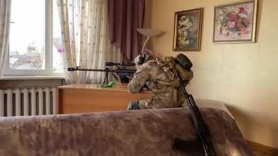 Ukrainian sniper working on Russian targets with trophy Russian rifle - 12.7mm АСВК .