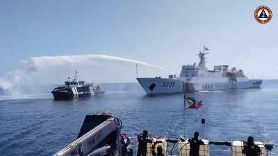 Footage released by Commodore Tarriela shows a larger Chinese Coast Guard ships blasting a Philippines Bureau of Fisheries boat with water cannons during a resupply mission. The water cannon actions resulted in damage to  communication and navigation syst