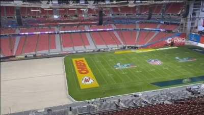 Rolling the Super Bowl field outside to get some sun