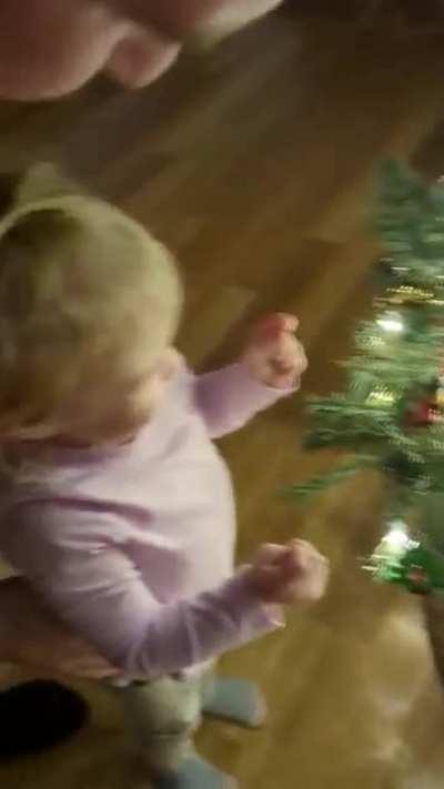 Daughter helps hang sacred ornaments passed down 3 generations