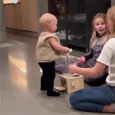 These big sisters were overjoyed to see their baby brother first steps