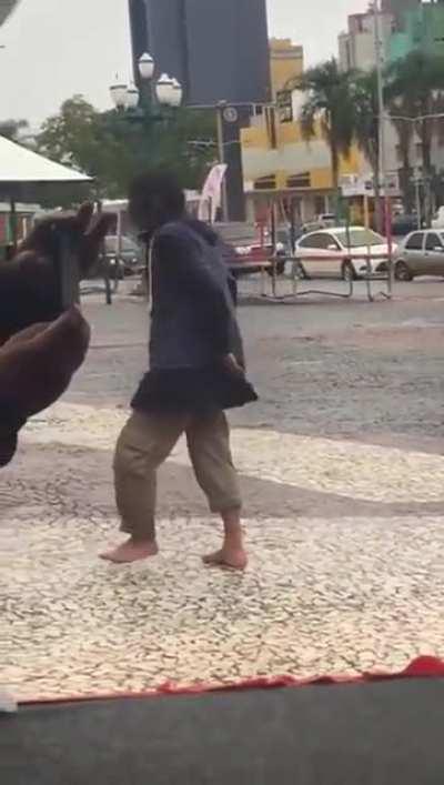 A drunk guy from my town trying to dance in a public square