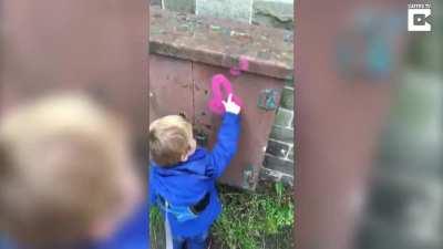 Little Kid Mistakes Rude Grafitti For Headphones