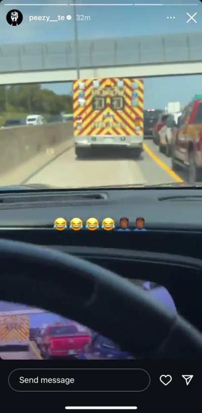 MC drives behind ambulance in traffic 