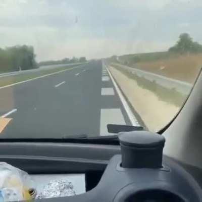 Musical highway with stripes on the road that become rhythmic music when the car is run over it