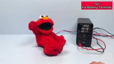 An Elmo toy under high voltage 