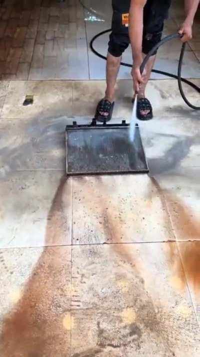 Pressure washing a radiator