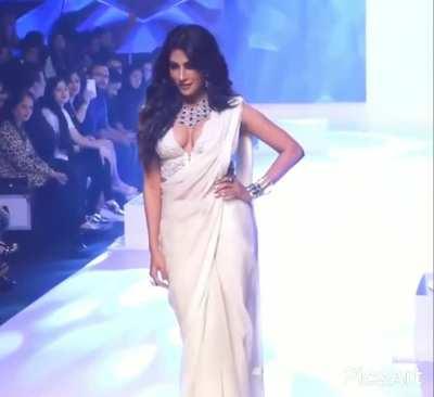 Chitrangada Singh in deep cut blouse saree giving too much of a cleavage show. ramp walk while her booty is swinging too.