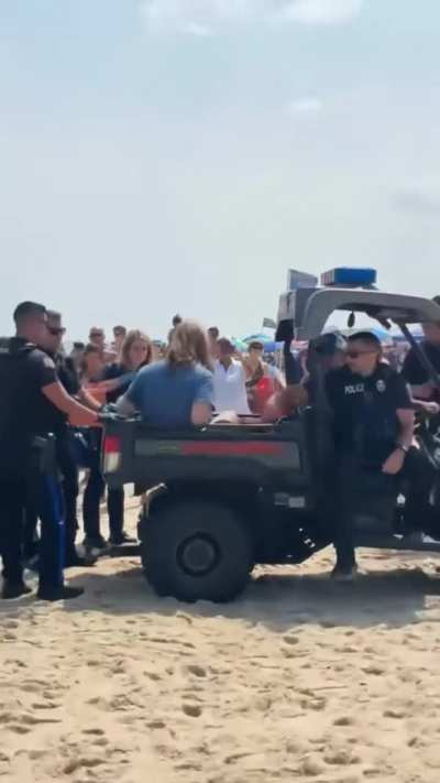 Another &quot;Beach Goer&quot; Carried Off by 6 NJ Police Officers Enforcing $80 &quot;Beach Badges&quot; on US Citizens To Use USA Public Beach &amp;amp; Ocean in their off-time. This comes after a surfer wasn't properly displaying his $80 &quot;beach badge&quot; was tackled, arrested, &amp;