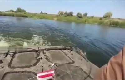 Ukrainian soldiers got a nice bonus that jumped right into the driver's hatch of their BMP-1 while they were crossing the river