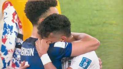 Irani and USA footballplayer give each other a hug after the game (1:0 USA)